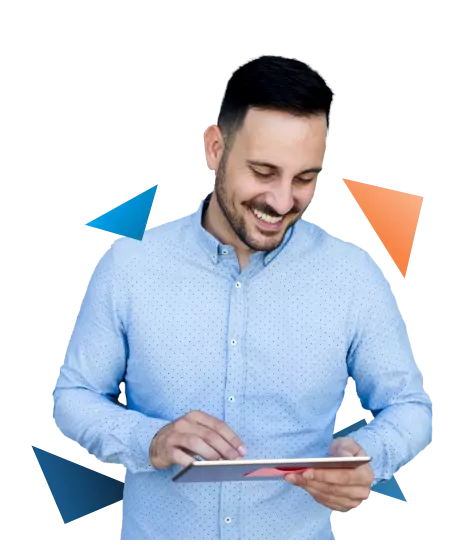 Man smiling while looking at tablet