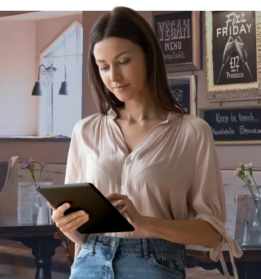 female tablet user in a Guesthouse and or pub