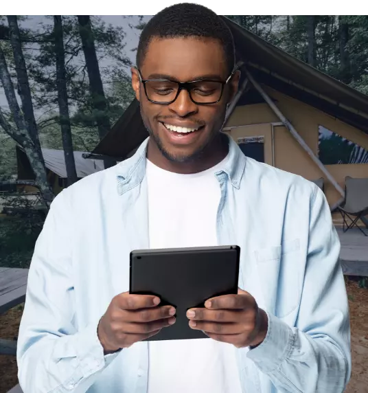 male tablet user outside a resort